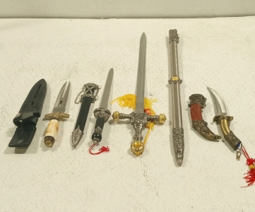 (1) Scimitar Style Knife 6in, (1) Two Pronged Dagger 8in, (1) Large Broadsword 26in, (1) Short Sword 11in