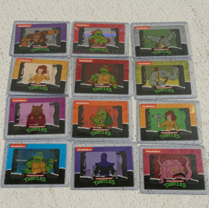 (12) Teenage Mutant Ninja Turtles Trading Cards in Top Loaders