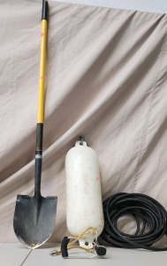 Shovel, Air Hose, Slingshot, And A Boat Bumper.