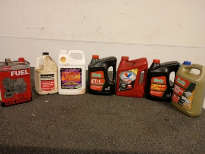 A Variety of Oil, Antifreeze, Transmission Fluid And Fuel For Coleman Camping Appliances