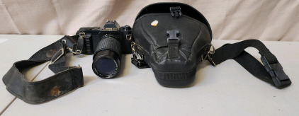 Canon T50 35mm SLR Film Camera With A Seikanon MC Auto Zoom Lens And Case.