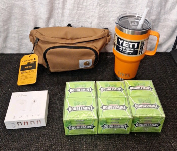 (1) Carhartt CB0401 Waist Pack, (1) Pair Of Wireless Earbuds, (1) YETI 35-Oz Rambler Mug W/ Straw Lid (3) Boxes Of 10-Fifteen Stick Packs Of Wrigley's DoubbleMint Gum
