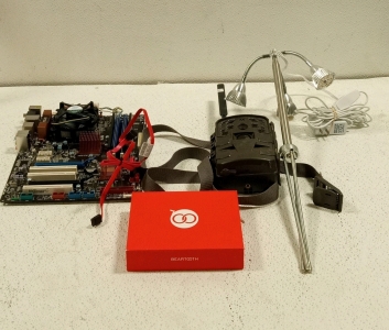 (1) Asus Gaming Computer Motherboard With Ram and Processor, (1) Set of Beartooth Cellphone Radios, (1) Led Grow Light, and (1) Moultrie Trail Camera