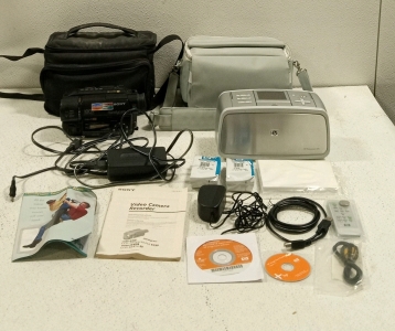 (1) Sony HandyCam Camcorder and (1) HP Photosmart 475 Portable Printer