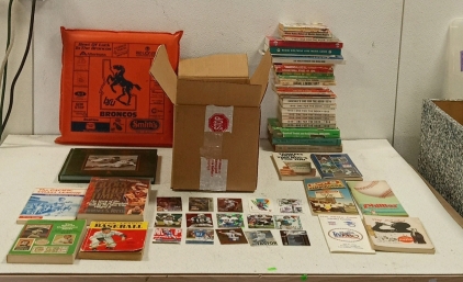 (1) Large Assortment of Sports Books, (1) Giant Box of 5000+ Sports Cards, and (1) Boise State Broncos Promotional Cushion