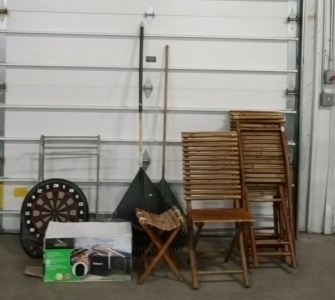 (1) Small Rack, (1) Dart Board, (1) Locking Mailbox, (2) Rakes, (4) Outdoor chairs, and (1) Outdoor Table
