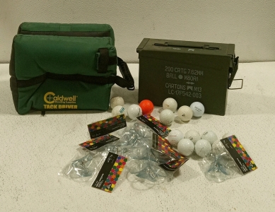 (1) Caldwell Shooting Supplies Tack Driver, (1) Small Ammo Box, (1) Assortment of Suction Cups and Golf Balls