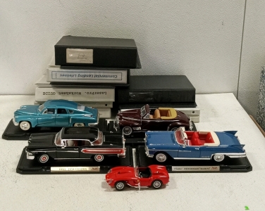 (5) Collectible Model Cars and (1) Bundle of Empty Binders