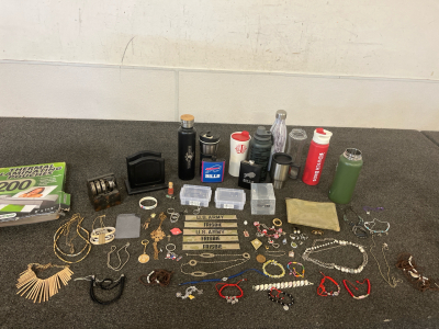 Water Bottles, Buffalo Bills Flasks, Variety of Jewelry Including Necklaces, Rings, Bracelets, Keychains, Empty Little Containers, Vintage Mechanical Counting Bank And Thermal Laminating Pouches