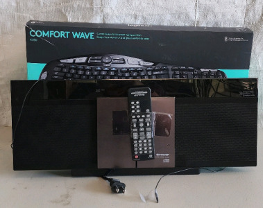 Logitech Comfort Wave Computer Keyboard And A Sharp Slim Micro System DK-KP80