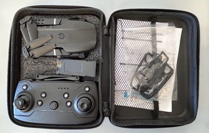 Small RC Drone With Charging Cable, Battery, and Spare Parts