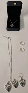 (6) Pieces Of Cosmetic Jewelry, (1) Heart Pendant W/Crystal, (1) Heart Pendant & EaringSet & (2) Rings
