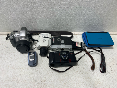 Assorted cameras, translator, flip phone
