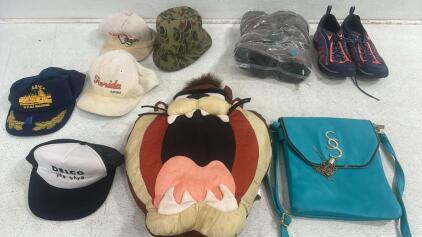(1) Pair of Merrell Trial Running Shoes, (1) Pair of Danner Camo Boots, (1) Teal SS Handbag, (1) Taz Polyseter Throw Pillow, and (5) Hats of varying styles