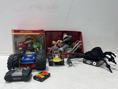 (1) M&M toy (1) big truck with controller and battery (1) helicopter (1) Harley Santa (1) Jumping spider (1) monster truck Electronic toys
