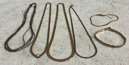 (2) Silver Necklaces (2) Gold Necklaces (2) Gold Bracelets
