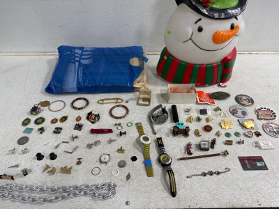 Assorted vintage collectibles, pins, jewelry and news papers.