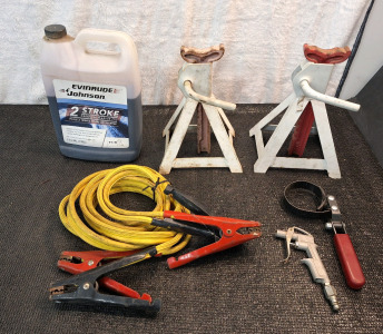 (1) Pair Of Jack Stands, (1) Set Of Jumper Cables, (1) Gallon Bottle 3/4 Full Of Marine 2 Stroke Oil, (1) Oil Wrench & (1) Blower Nozzle