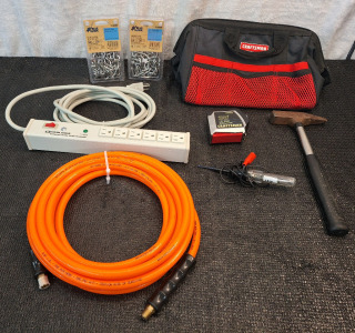 (1) 25' Air Hose, (1) Surge Protected Power Strip, (2) 10' Legnths Of 5/32" Stainless Steel Chain, (1) Hammer, (1) 12V Test Probe (1) Craftsman 30' Tape Measure & (1) Craftsman Soft Tool Bag