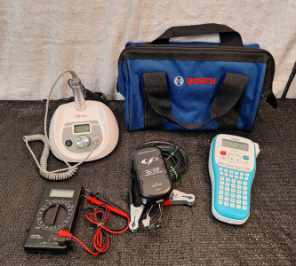 (1) Bella Variable Speed Rotary Tool, (1) Digital Multi-Meter, (1) Schumacher Battery Charger, (1) Brother Label Maker & (1) Bosch Soft Tool Bag