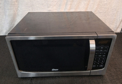 (1) Oster 1100 Watt Microwave, 22"L x 17"W x 11"T