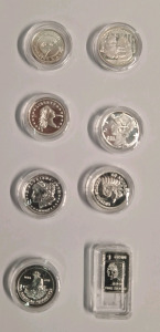 (7) Different 1-Gram Siver Rounds & (1) Bar In Airtight Capsules