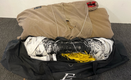 A Sleeping Bag & A Volleyball Net with Bag