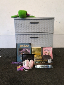 Assortment of Kids Books and Headphones and Toys and Cream Curtains
