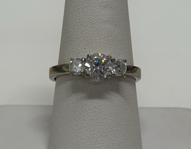 Three-Stone Ring with Round Cut Clear Stones in Silver Toned Ring Setting
