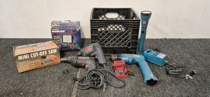 Makita Light and Battery Charger, Makita DC9.6V Ave Driver, Cen-Tech Seven Function Digital Multimeter, Master Mechanic 3/8" Drill, Skil 3/8" Drill, Nice Worklight, Mini Cut-Off Saw, Comes with Crate
