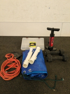 Ball pump two ten pound weights blue tarp