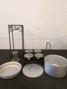 Two dog bowls with stands and bird feeder and a canning pot