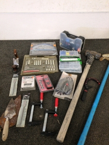 Assortment of Tools Including Screws and a Socket Wrench set