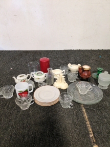 Assortment of vintage dishes and cups along with candle holders