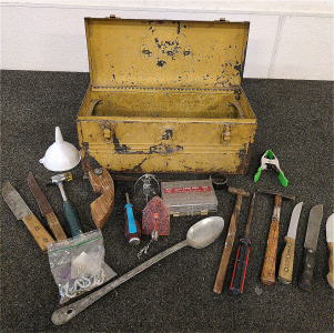 Antique Metal Tool Box With Rustic Tools And Knives