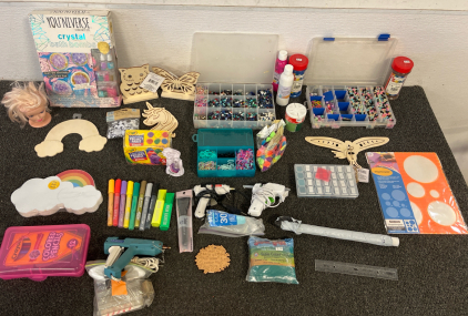 Lots And Lots Of Crafting Supplies Including Colored Sand, Glue Guns With Glue Sticks And Much More For The Crafting Enthusiasts