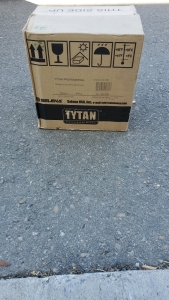 Box Of TYTAN PROFESSIONAL Subfloor Pro High Yield Adhesive.