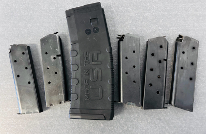 (5) Colt 45 Auto Magazine Clips and (1) 5.56x45 Magazine and Ammunition (.223)
