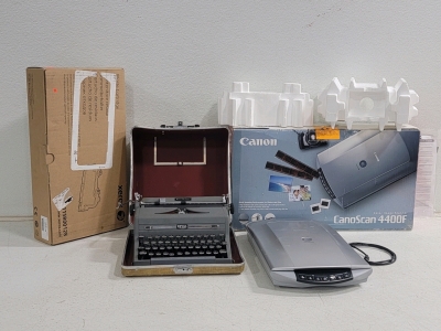 (1)Royal Quiet De Luxe Typewriter, (1) Canon Canon can 4400F, (1) Xerox Waste Cartridge,