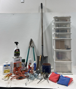 Assorted Outdoor Item (1) tall Storage Stand (1) Small Pot (1) Flat Blade Shovel (2) Extension Cords (1) Limb Trimmer and more