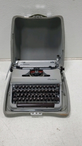 Olympia SM3 De Luxe Portable Typewriter In Its Original Carrying Case.