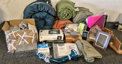 (4) Sleeping Bags, Blow up Float, Box of Light Bulbs, Jewelry Box, HoMedics Handheld Percussion Massage with Heat, Apple Corer, Nic Nacs, House hold Items, Digital Picture Frame, File folders, Box of Miscellaneous Tools and Household Items, Prosthetic So
