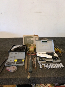 Jigsaw/Saber Saw Drill hammer<br/>Pliers<br/>A file<br/>A set of screwdrivers or screwdriver bits in a case<br/>A set of sockets and a ratchet<br/>Other miscellaneous tools like wrenches or pliers