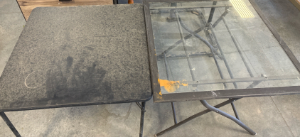 2 Folding Tables (Glass: L 3&rsquo; H 2&rsquo; 3.5&rdquo;, Black: L 2&rsquo; 9.5&rdquo; H 2&rsquo; 3.25&rdquo;)