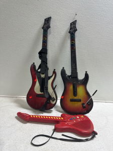 (2) Guitar Hero Guitars & (1) Radio Shack Guitar