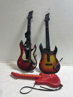 (2) Guitar Hero Guitars & (1) Radio Shack Guitar