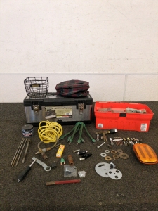 Two tool boxes and varies tools including bolts and washers and screws