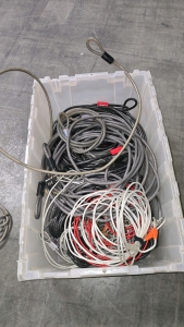 Assorted bin contains a mix of cable locks, likely for securing bicycles or other items.