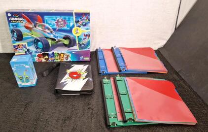 (1) PJMasks Power Heroes Vehicle & Action Figure, (1) 2-Piece Walkie Talkie Set, (1) Card Binder & (2) 2-Packs Of Expanding 1" Ring Binders
