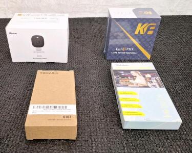 (1) Mini Security Camera, (1) Pair Of Hearing Aids, (1) Am/Fm/Alarm Clock Radio & (1) Pair Of Wireless Headphones